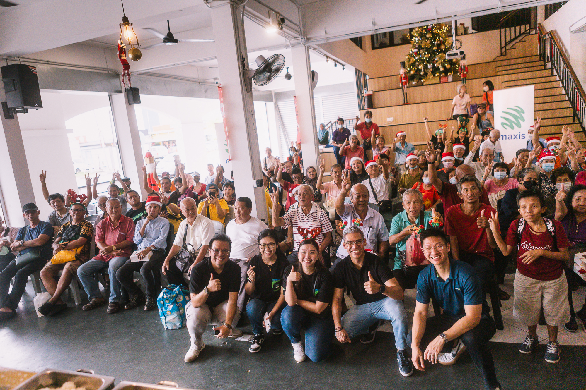 Maxis brings Christmas cheer to senior citizens, homeless in Kuching